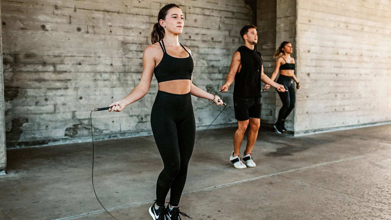 2 women and a man using tru grit jump ropes
