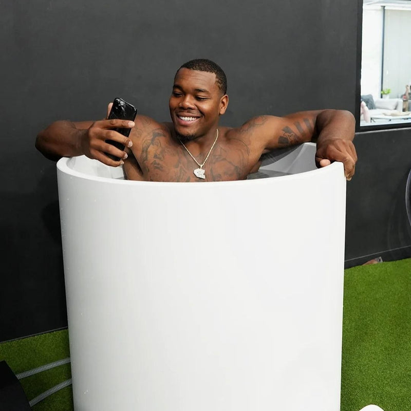 Man On Phone While Using Cold Life Plunge Ice Bath Tub Bundle Lifestyle Image 