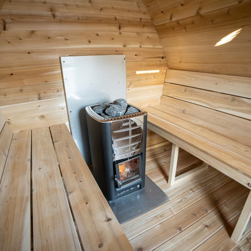 inside sauna facing heater and benches