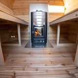 inside sauna facing heater and underneath benches