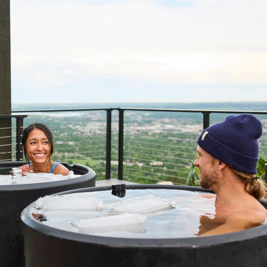 Man and woman smiling in Ice Barrel 300 Cold Plunge Tub