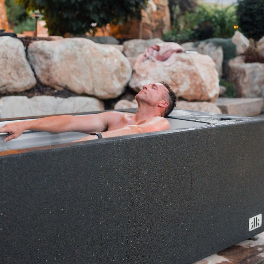 Man relaxing in King Kool Cold Plunge Tub