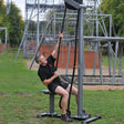 Man using RX5500 Outdoor Vertical Rope Pull Machine