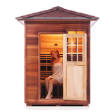 woman sitting in 3 person outdoor infrared sauna
