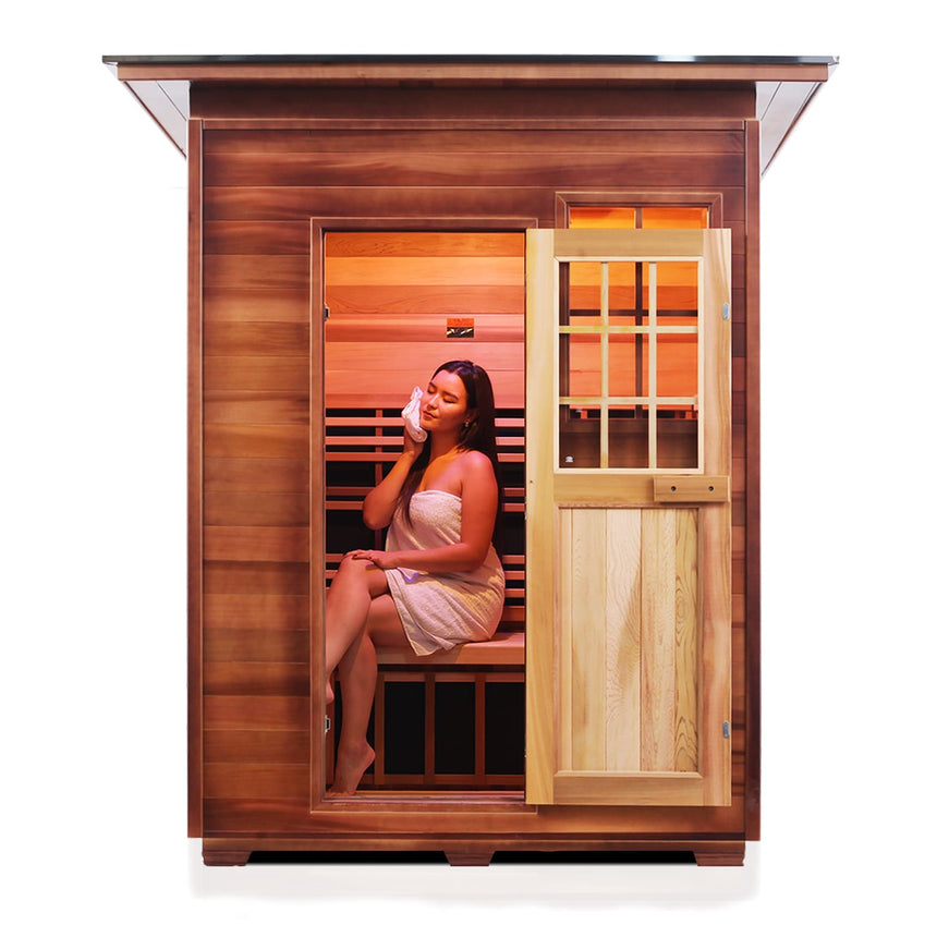 woman sitting in 3 person outdoor infrared sauna