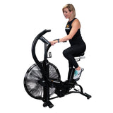Woman using Stroops Air Bike white background