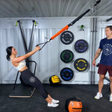 Woman using Body Weight Gym Suspension Trainer