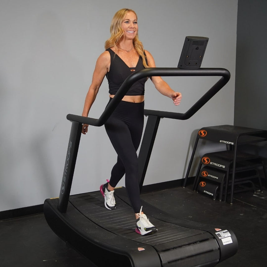 woman using Opticurve Curved Treadmill 