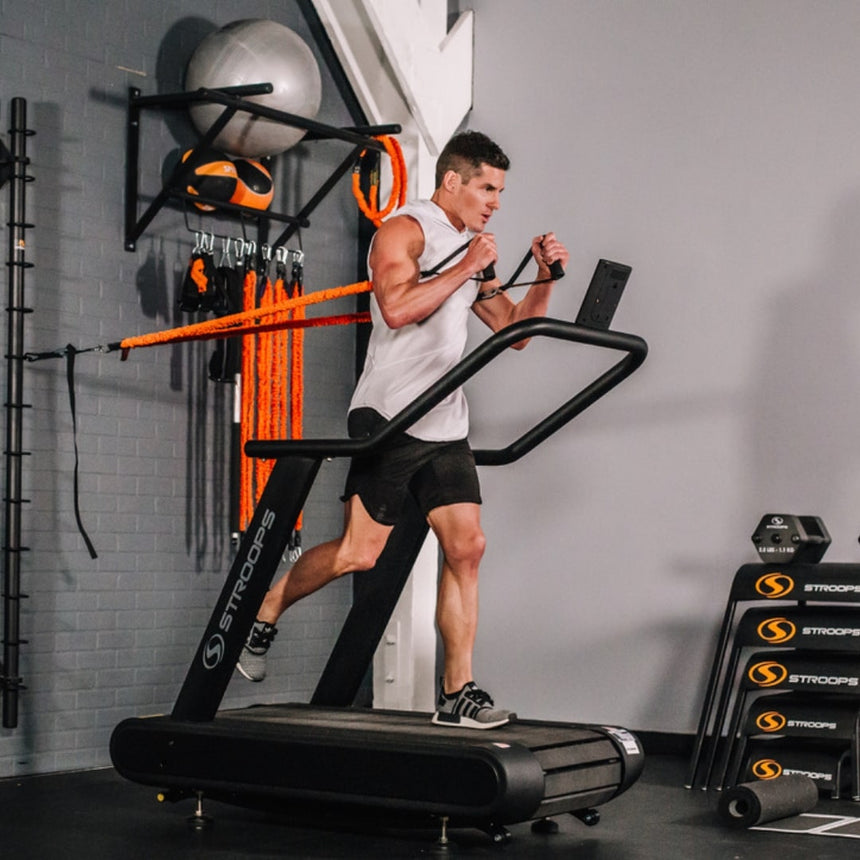 man using Optimill® Flat Motorless Treadmill
