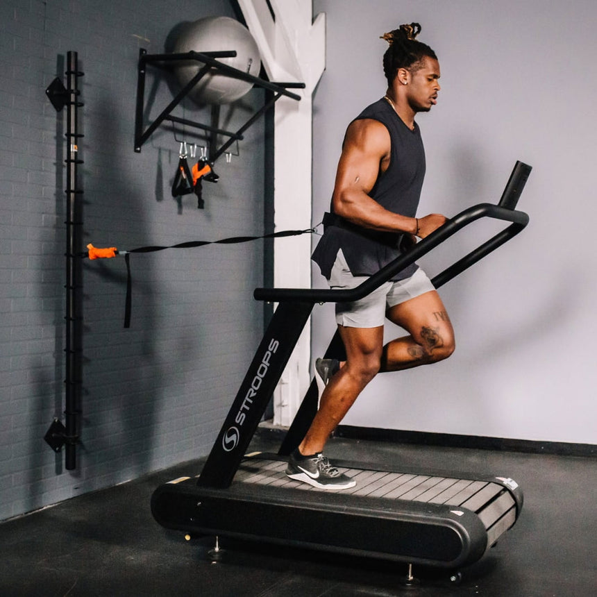 man using Optimill® Flat Motorless Treadmill in gym