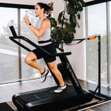 woman using Optimill® Flat Motorless Treadmill in home