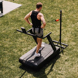 man using Optimill® Flat Motorless Treadmill outside backyard
