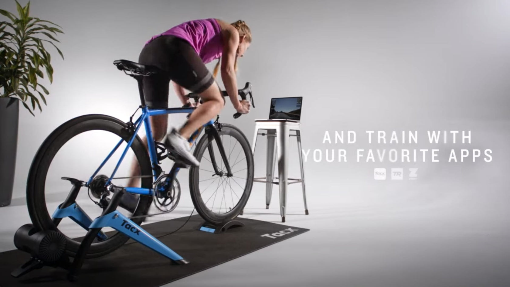 Woman using the Tacx Boost Smart Trainer in home