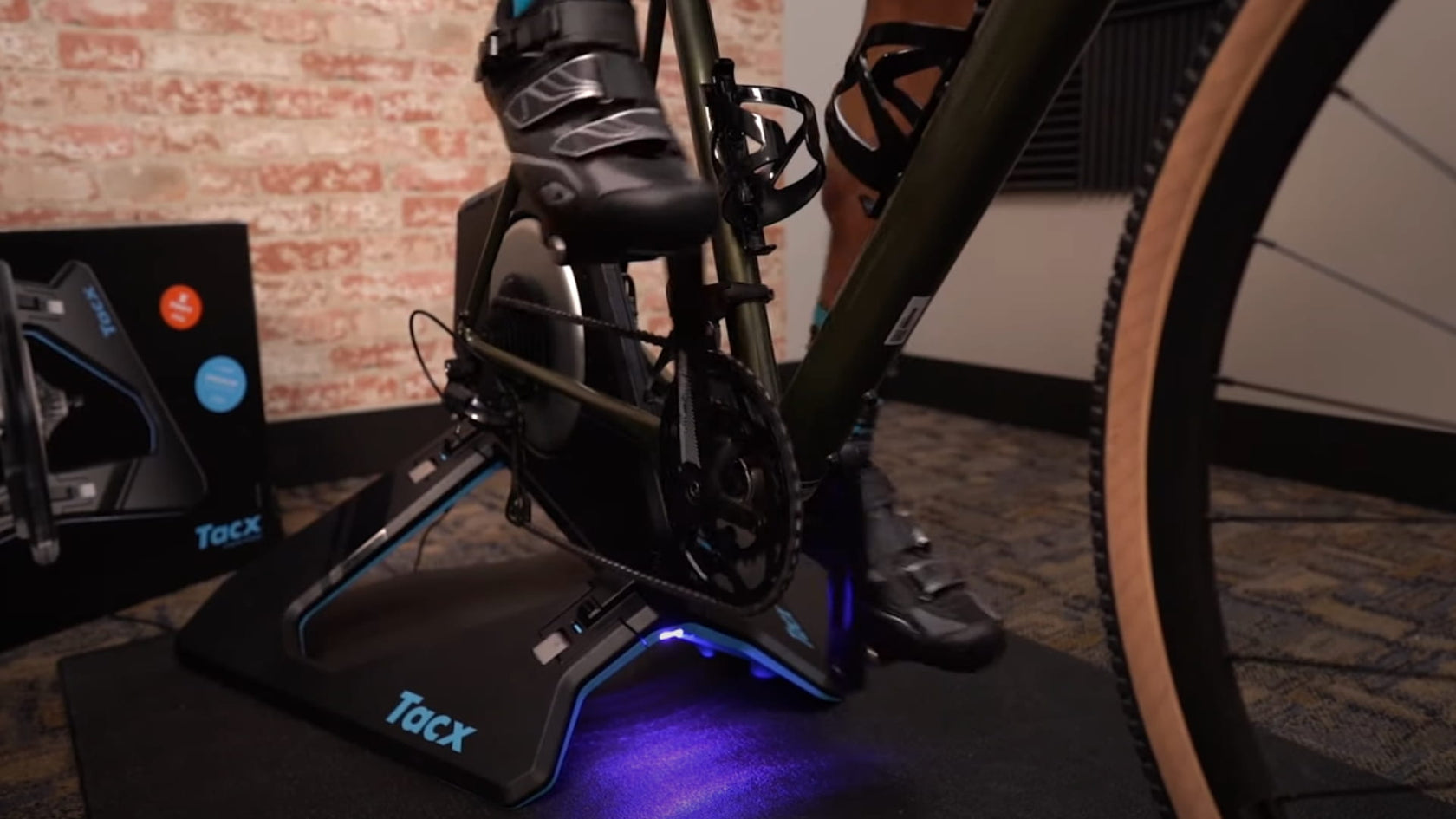Man riding Tacx NEO 2T Smart Trainer lifestyle