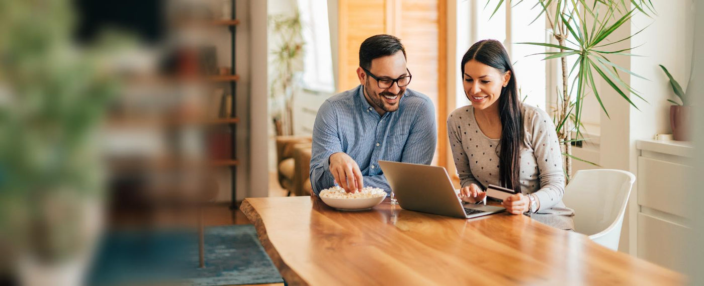 affirm cover image couple happy staring at laptop