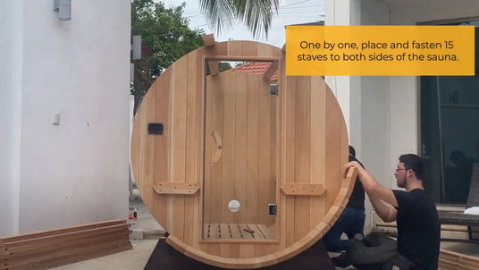 two men putting together scandia barrel sauna with assembly